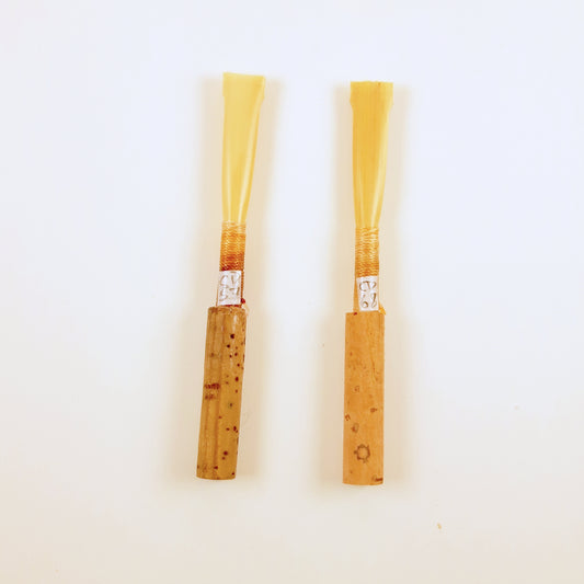 Two tied oboe reed blanks showing their individual serial numbers